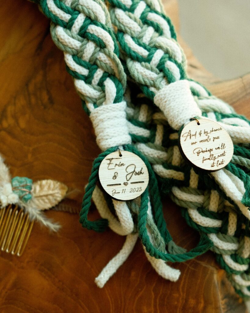 The green and white ropes that will be used in their irish hand fasting ceremony on the live edge wood table