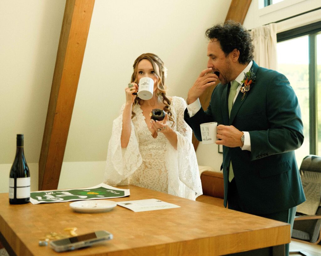 erin and josh drinking coffee and eating vegan chocolate covered donuts