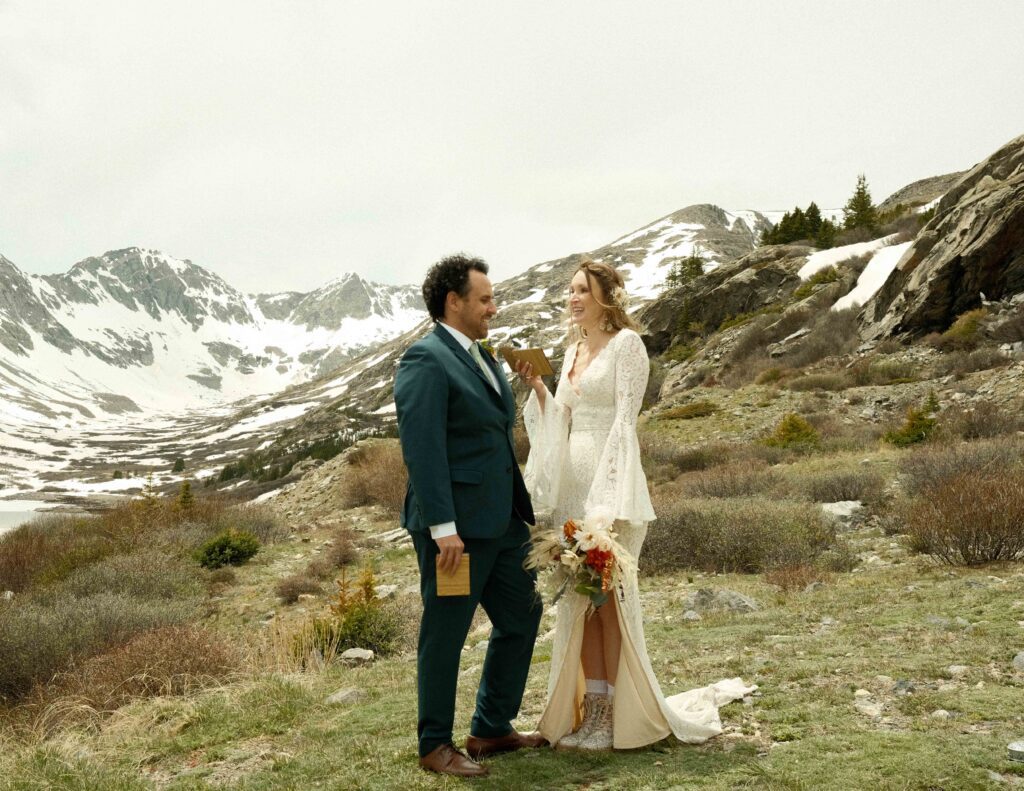 Erin and Josh officially eloping in the mountains of colorado in their wedding outfits. 