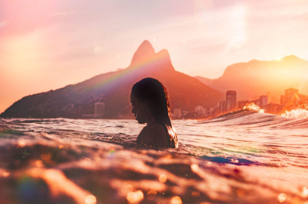 a woman swimming at the beach in Copacabana in Rio de Janeiro